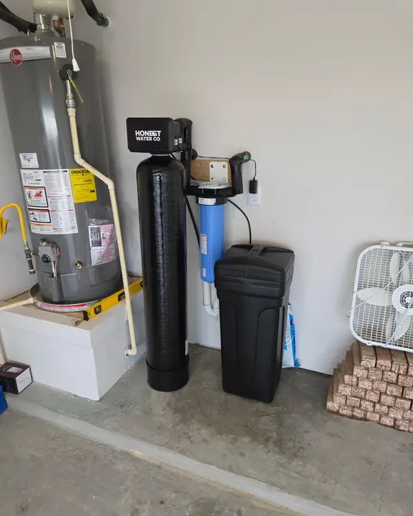 Honest Water Co water softener with whole-home sediment filter next to a water heater